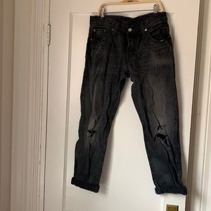 Levi’s black distressed button fly 501 jeans